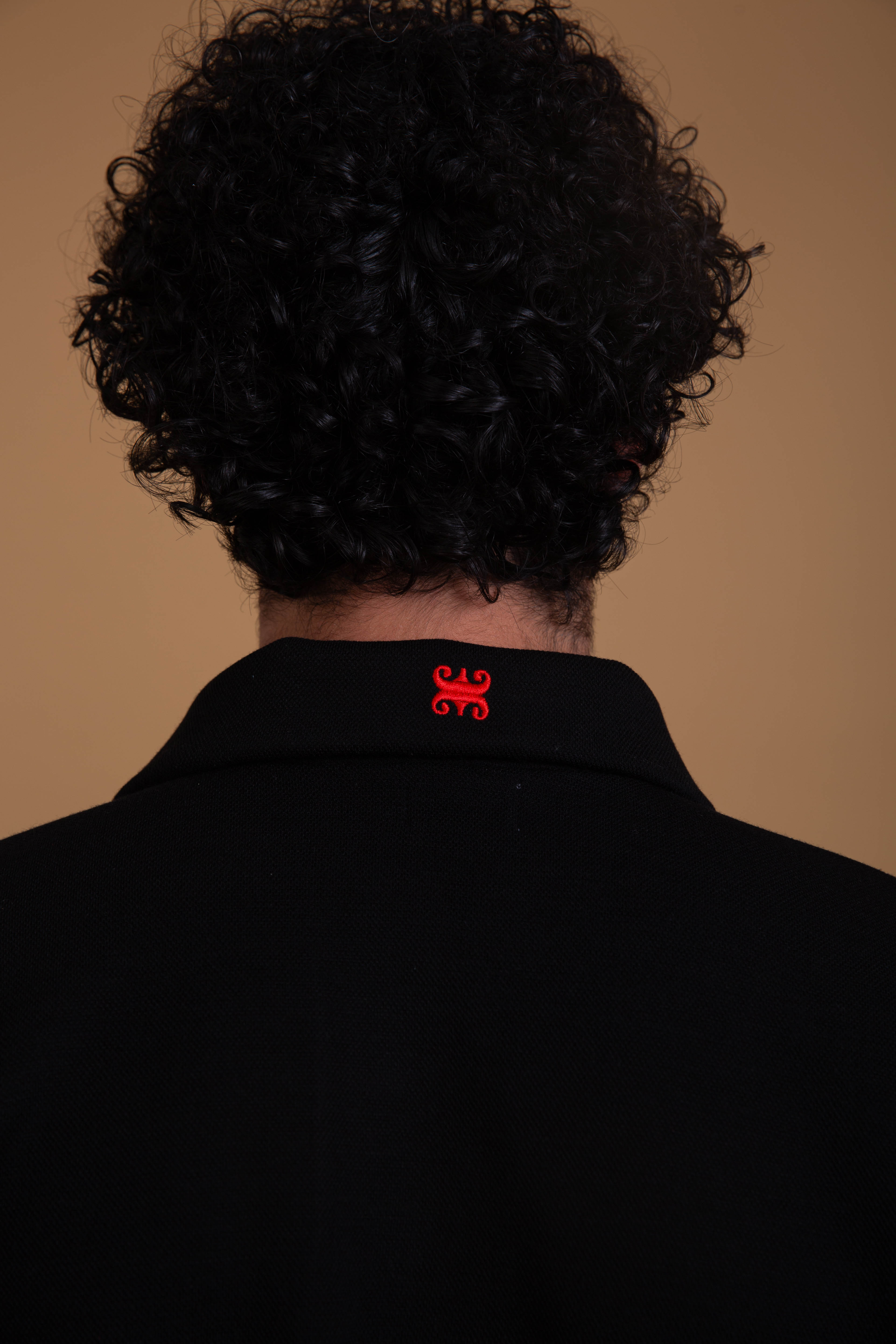 René — Polo noir maille piquée